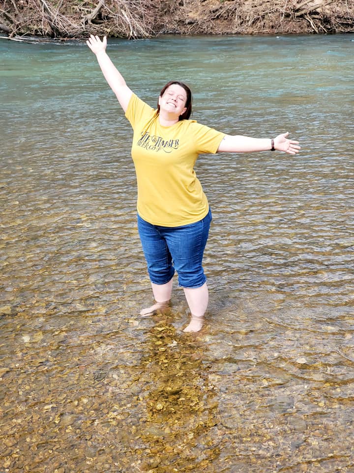 girl in a river happy