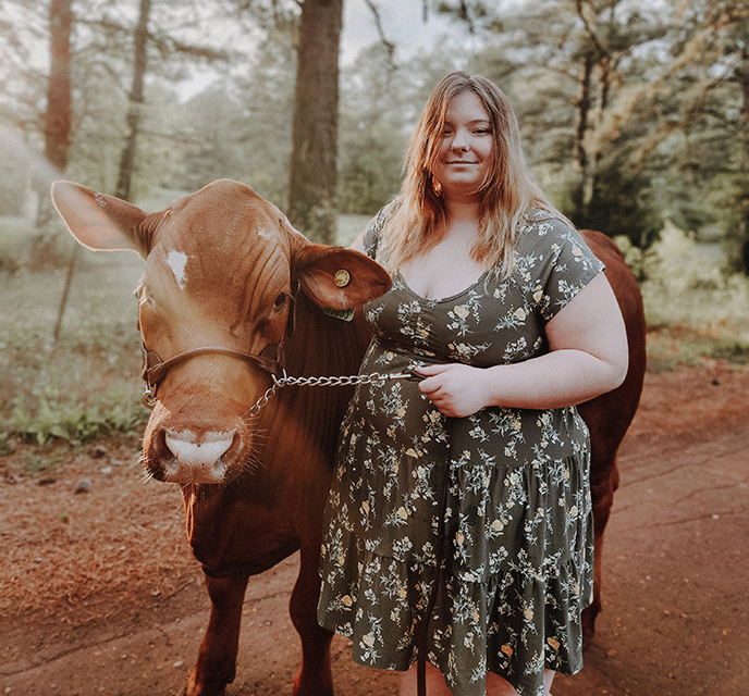 girl and a cow