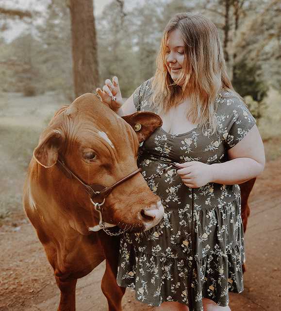 Girl petting cow